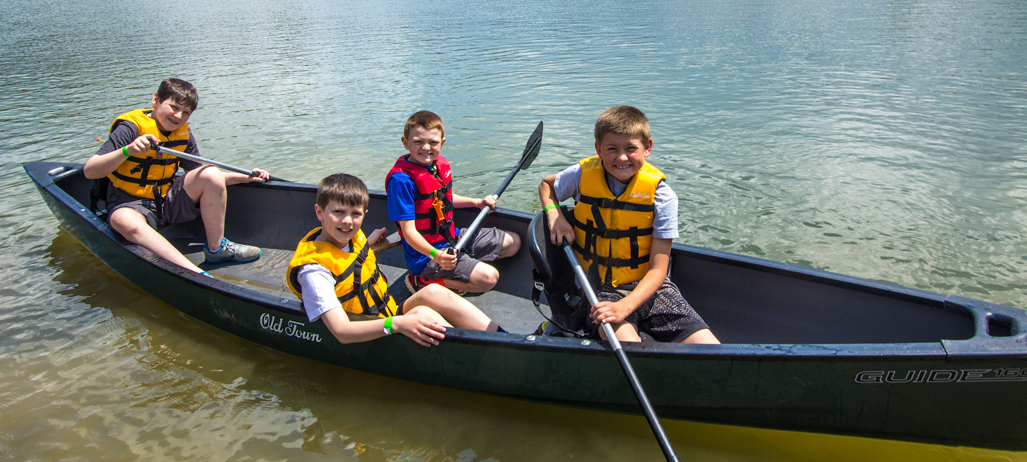 A group of boys canoeing